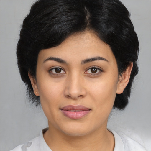 Joyful asian young-adult female with medium  black hair and brown eyes