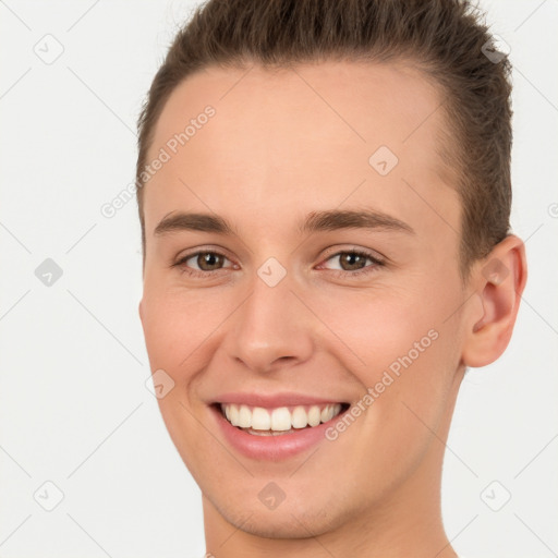 Joyful white young-adult female with short  brown hair and brown eyes