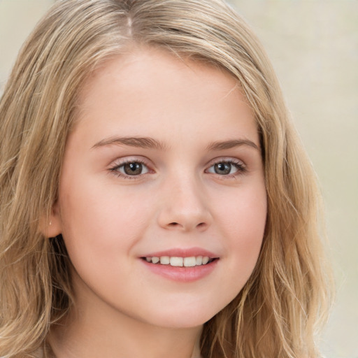 Joyful white child female with long  brown hair and brown eyes