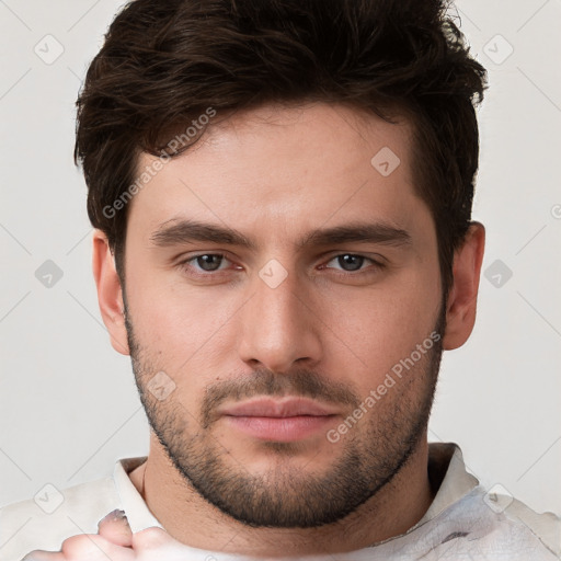 Neutral white young-adult male with short  brown hair and brown eyes