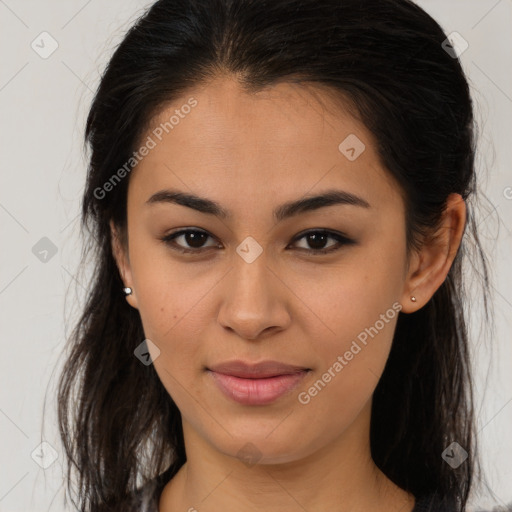 Joyful latino young-adult female with long  brown hair and brown eyes