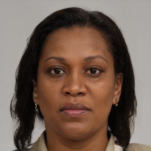 Joyful black young-adult female with medium  brown hair and brown eyes