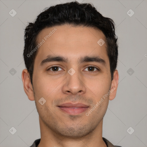 Joyful white young-adult male with short  black hair and brown eyes