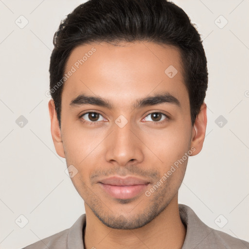 Joyful latino young-adult male with short  brown hair and brown eyes