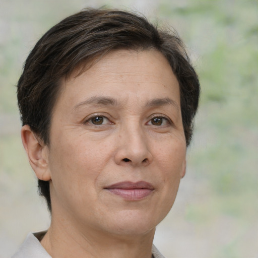 Joyful white adult female with short  brown hair and brown eyes