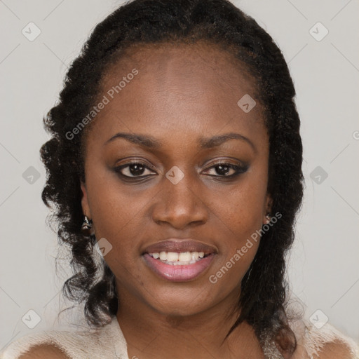 Joyful black young-adult female with long  brown hair and brown eyes