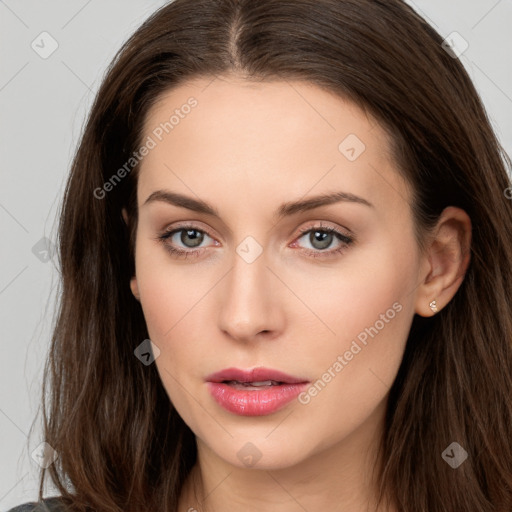 Neutral white young-adult female with long  brown hair and brown eyes