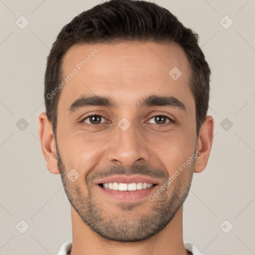 Joyful white young-adult male with short  brown hair and brown eyes