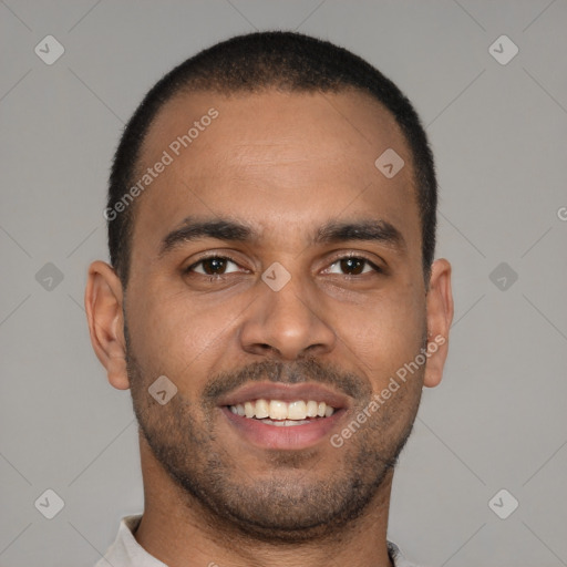 Joyful black young-adult male with short  brown hair and brown eyes