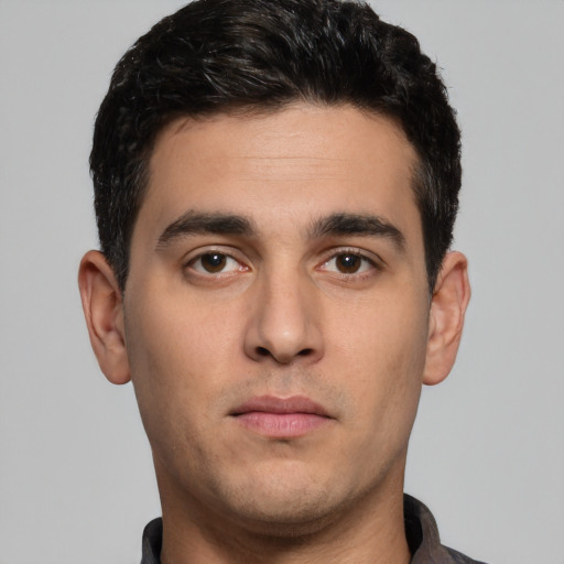 Neutral white young-adult male with short  black hair and brown eyes