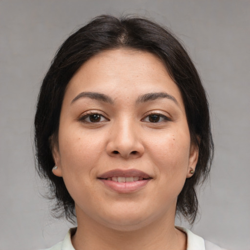 Joyful white young-adult female with medium  brown hair and brown eyes
