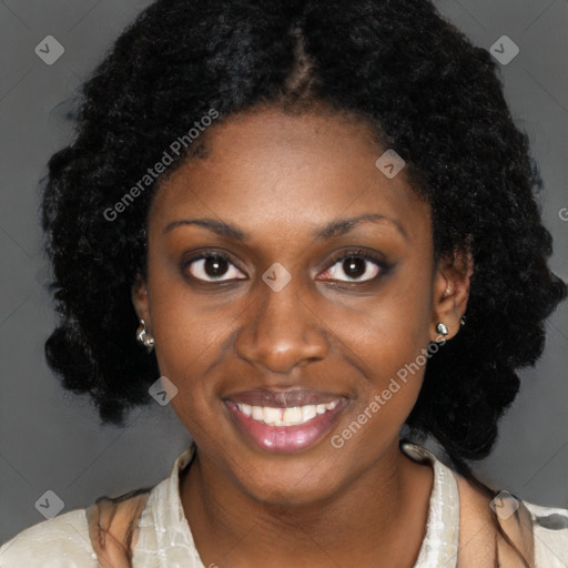 Joyful black young-adult female with long  brown hair and brown eyes