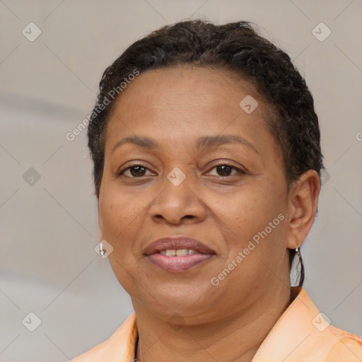 Joyful black adult female with short  brown hair and brown eyes