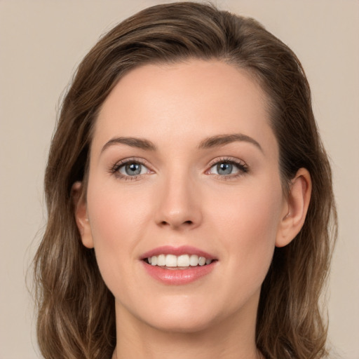 Joyful white young-adult female with medium  brown hair and green eyes