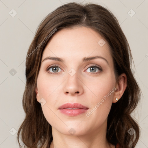 Neutral white young-adult female with medium  brown hair and green eyes