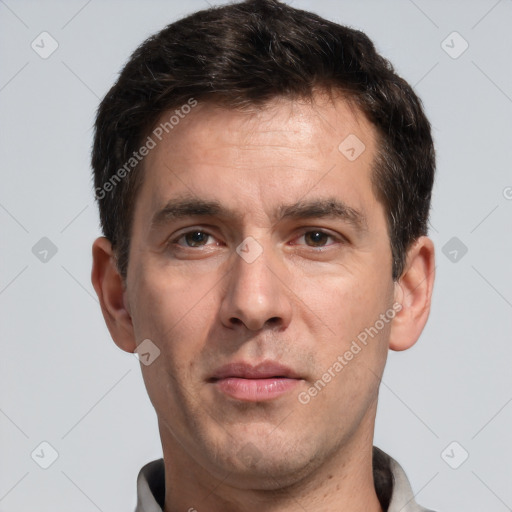 Joyful white adult male with short  brown hair and brown eyes