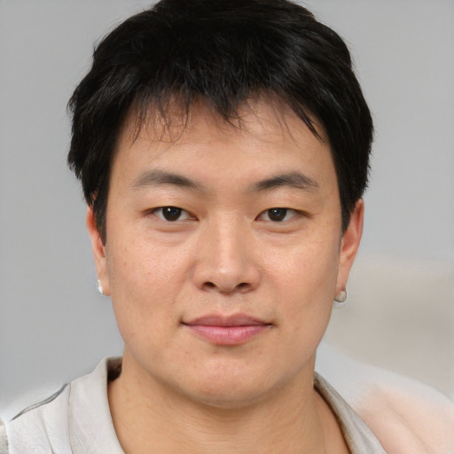 Neutral asian young-adult male with short  brown hair and brown eyes