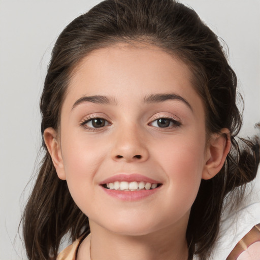 Joyful white child female with medium  brown hair and brown eyes