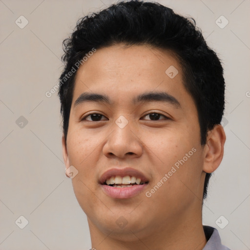 Joyful asian young-adult male with short  black hair and brown eyes