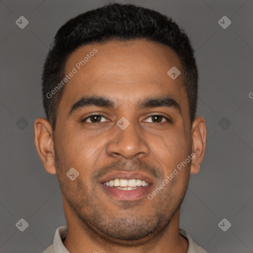 Joyful black young-adult male with short  brown hair and brown eyes