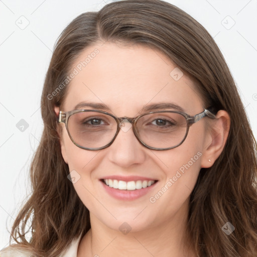 Joyful white young-adult female with long  brown hair and blue eyes