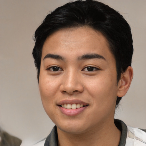 Joyful asian young-adult female with medium  black hair and brown eyes