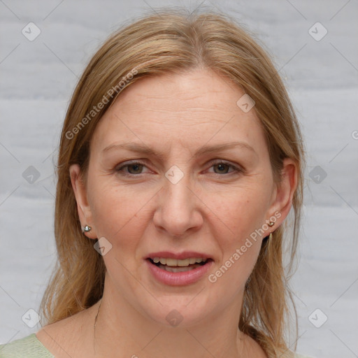 Joyful white adult female with medium  brown hair and grey eyes