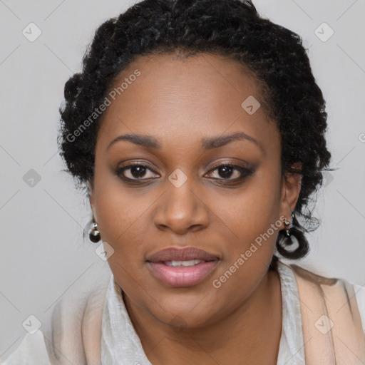 Joyful black young-adult female with long  black hair and brown eyes