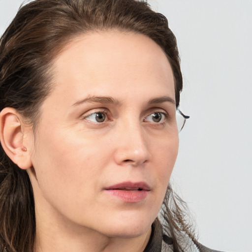 Neutral white young-adult female with long  brown hair and grey eyes