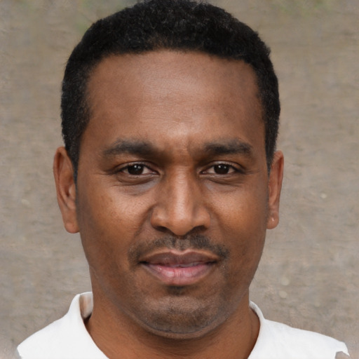 Neutral black young-adult male with short  black hair and brown eyes