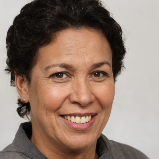 Joyful white adult female with short  brown hair and brown eyes