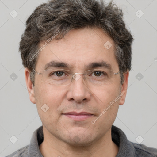 Joyful white adult male with short  brown hair and grey eyes