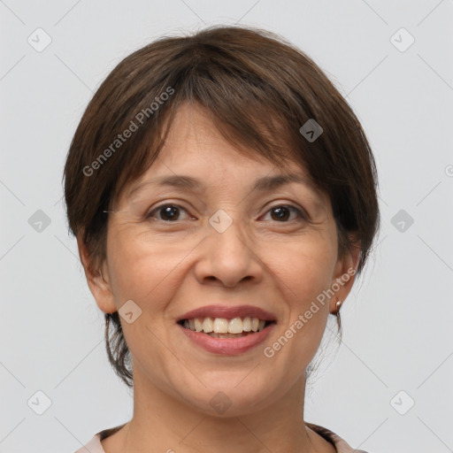 Joyful white adult female with medium  brown hair and brown eyes