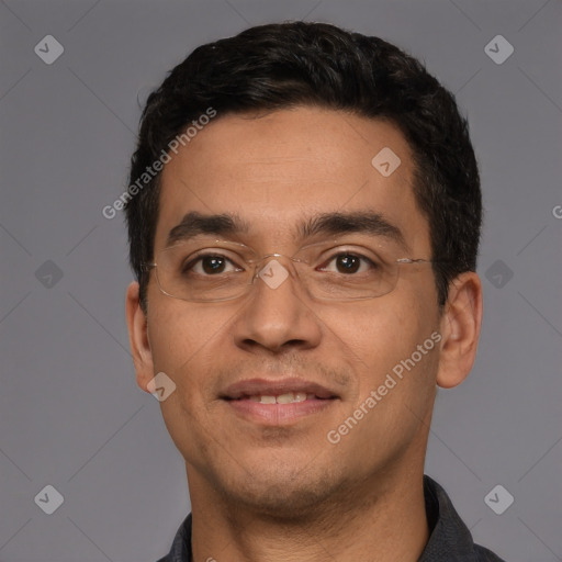 Joyful white young-adult male with short  black hair and brown eyes