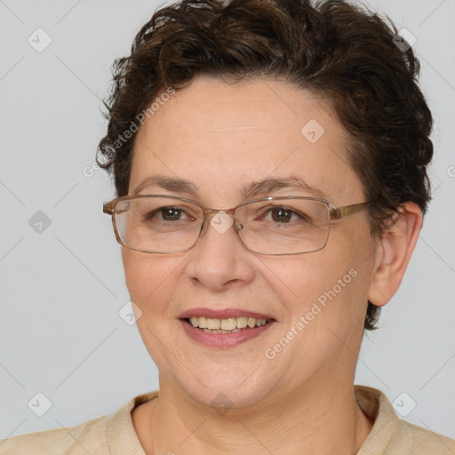 Joyful white adult female with short  brown hair and brown eyes