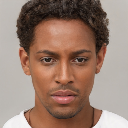 Neutral black young-adult male with short  brown hair and brown eyes