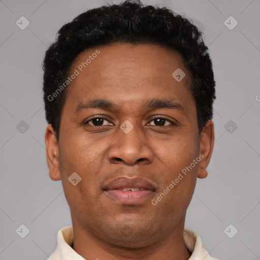 Joyful latino young-adult male with short  brown hair and brown eyes