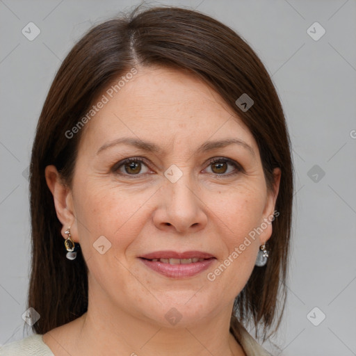 Joyful white adult female with medium  brown hair and brown eyes