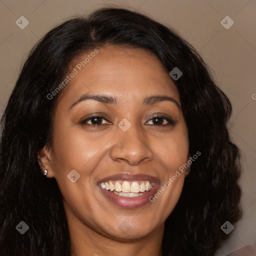 Joyful black young-adult female with long  black hair and brown eyes