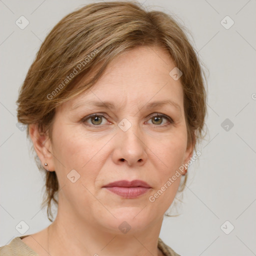 Joyful white adult female with medium  brown hair and green eyes