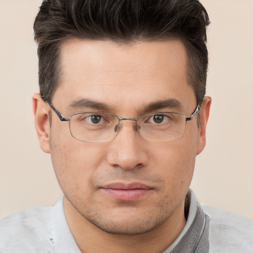 Joyful white adult male with short  brown hair and brown eyes