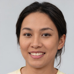 Joyful asian young-adult female with medium  brown hair and brown eyes