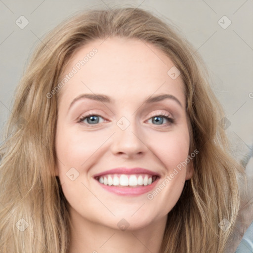 Joyful white young-adult female with long  brown hair and blue eyes