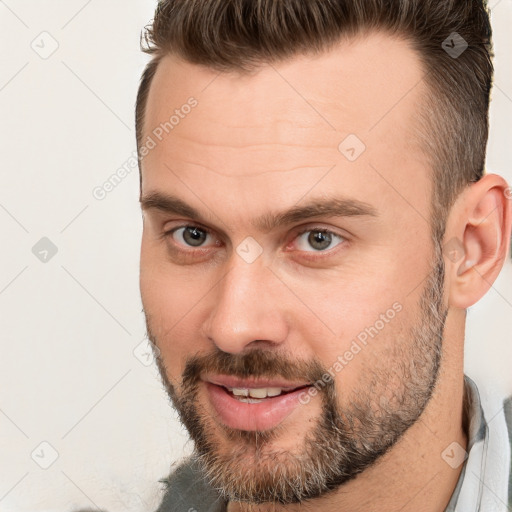 Joyful white adult male with short  brown hair and brown eyes