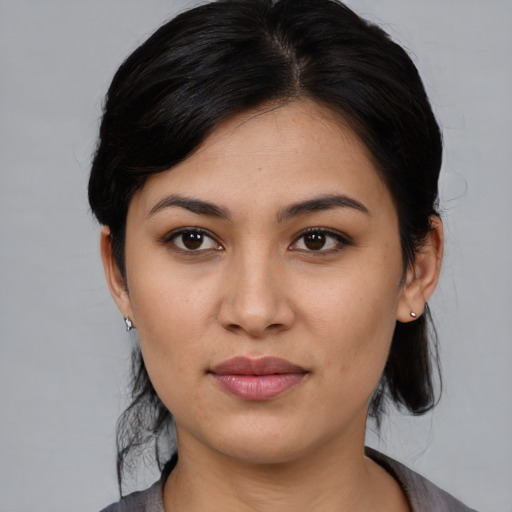 Joyful white young-adult female with medium  black hair and brown eyes