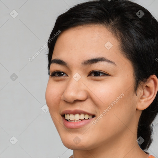 Joyful asian young-adult female with medium  brown hair and brown eyes