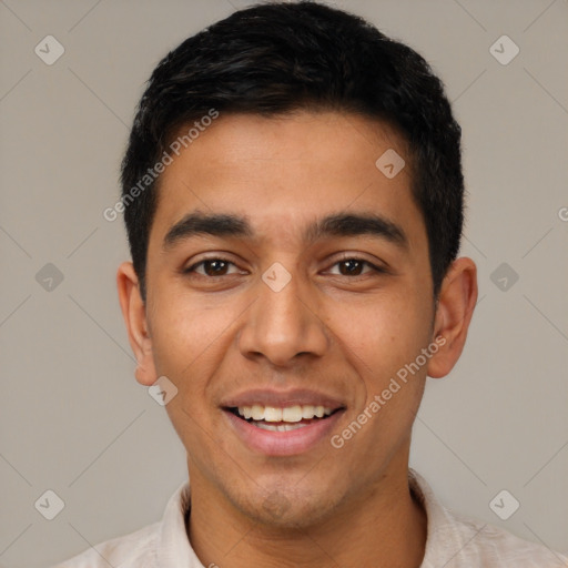 Joyful latino young-adult male with short  black hair and brown eyes