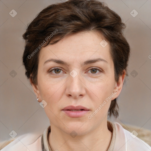 Joyful white adult female with short  brown hair and brown eyes