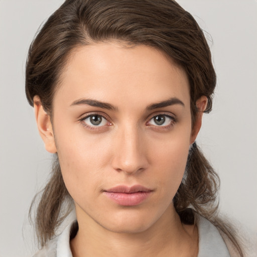 Neutral white young-adult female with medium  brown hair and brown eyes