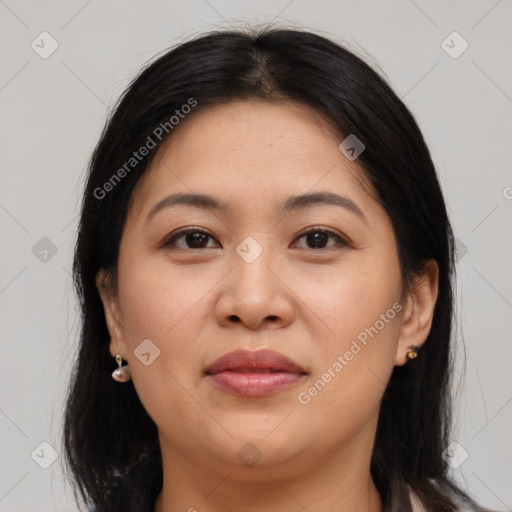 Joyful asian young-adult female with long  brown hair and brown eyes